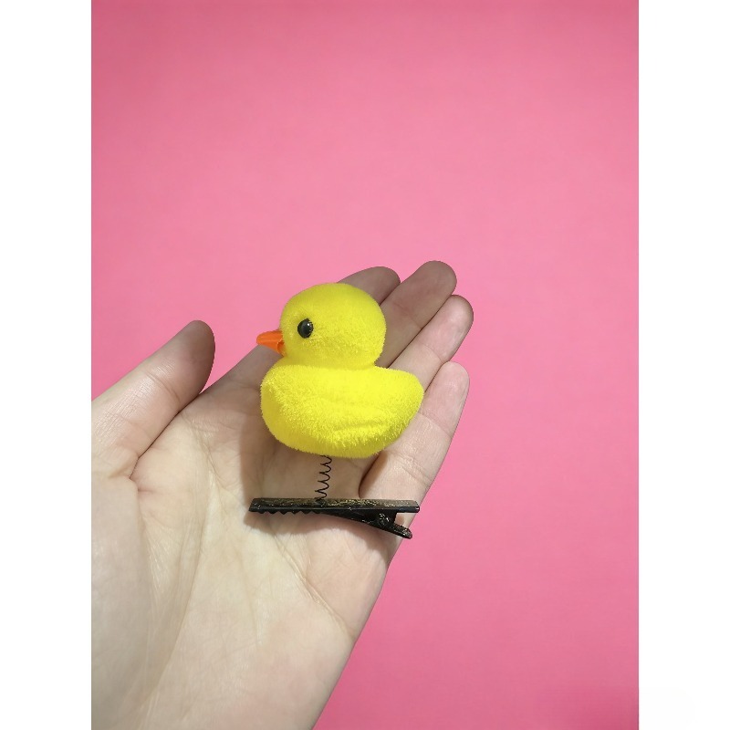 مشبك شعر على شكل بطة صفراء كرت - مراجعة Photography Duck وسعره