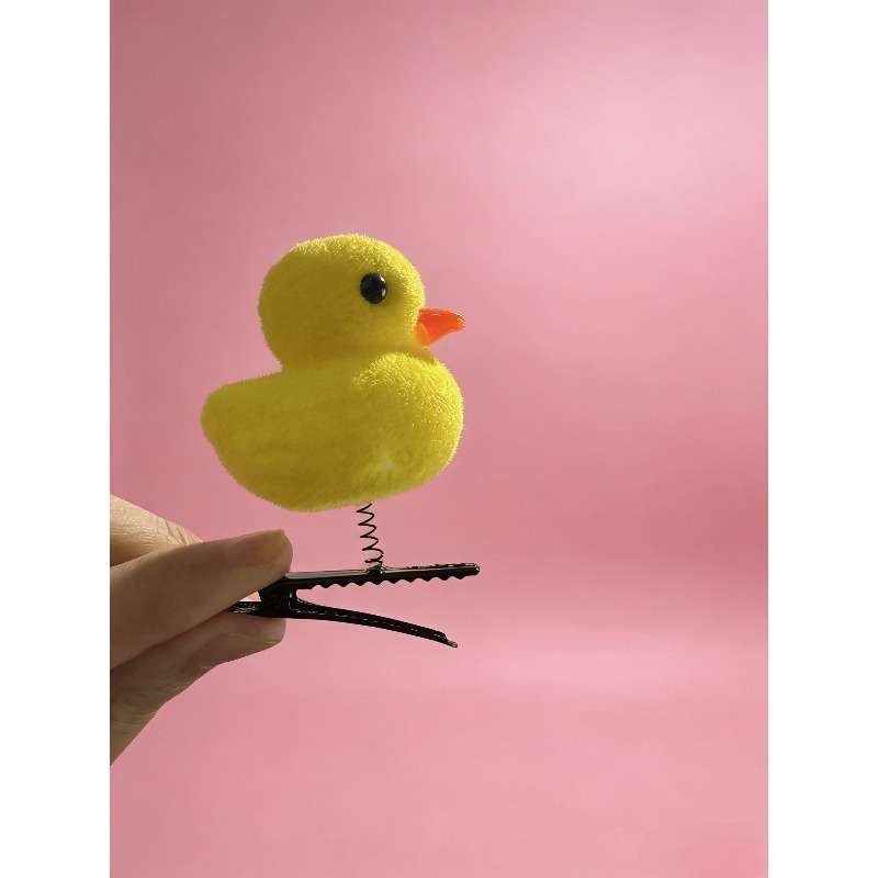 مشبك شعر على شكل بطة صفراء كرت - مراجعة Photography Duck وسعره